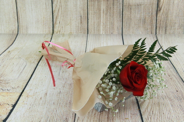 A Singe Red Rose and Baby's Breath Wrapped from Flowers by Ray and Sharon in Muskegon, MI